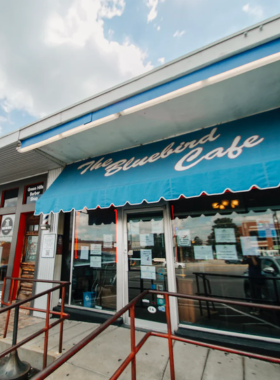 7. Bluebird Cafe This image shows a performance at the Bluebird Cafe, an intimate venue in Nashville where songwriters perform their songs in the round. The cozy atmosphere allows for a personal music experience, making it a must-visit for music enthusiasts.
