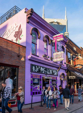 9. Tootsie’s Orchid Lounge This image shows the lively atmosphere at Tootsie’s Orchid Lounge, a legendary honky-tonk bar in Nashville. The three-story venue is filled with live music, where both up-and-coming and famous artists perform, offering an authentic Nashville music experience.