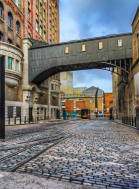 This image shows the Guinness Storehouse in Dublin, with visitors exploring interactive exhibits about the brewing process. The Gravity Bar offers stunning panoramic views of Dublin, where visitors enjoy freshly poured pints of Guinness beer.