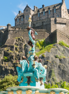 This image shows Edinburgh Castle, a historic fortress on Castle Rock in Scotland, with ancient stone walls, beautiful architecture, and a stunning view of the surrounding city, showcasing its royal and cultural significance.