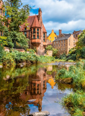 This image shows Dean Village, a picturesque and historic area in Edinburgh with cobblestone streets, old mills, and charming houses along the Water of Leith, offering a peaceful escape from the city.