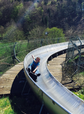 This image shows an exciting ride on SolarBob, an eco-friendly bobsled track powered by solar energy. It’s an exhilarating experience for those looking for an adventure, with the added bonus of sustainability.