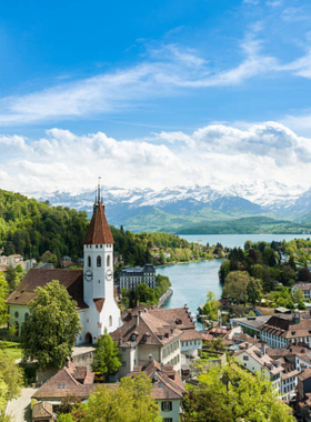 This image shows tourists floating down the Aare River from Thun to Bern, enjoying the tranquil ride and beautiful Swiss landscapes. The serene journey offers a unique way to experience the natural beauty of Switzerland.