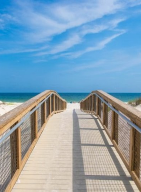 This image shows the calm waves gently lapping against the shores of Johnson Beach, located on Perdido Key. The quiet, undeveloped beach is perfect for a relaxing day in the sun, surrounded by natural beauty with scenic views of the Gulf of Mexico and untouched dunes.