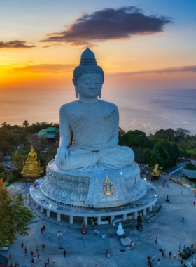 This image shows the majestic Big Buddha statue on Nakkerd Hill in Phuket. The towering 45-meter marble statue sits atop the hill, offering breathtaking views of the surrounding island and sea. Visitors often come here to reflect, enjoy panoramic scenery, and connect with Thai spiritual culture.