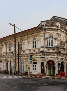 This image shows the vibrant streets of Phuket Old Town, lined with colorful Sino-Portuguese buildings, quaint shops, and bustling markets. The area exudes a mix of historical and cultural charm, with its unique architecture and lively atmosphere captivating every visitor.