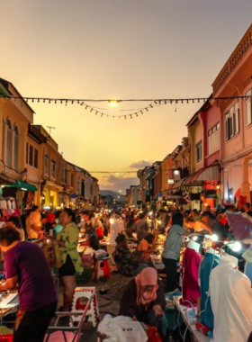 This image shows a stall at the Thai Amulet Market in Phuket, displaying various intricately designed charms and amulets. Each piece reflects Thai spirituality, offering blessings of luck, protection, or love, and showcases the cultural significance of these small treasures.