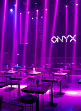 This image shows Onyx, one of Bangkok's largest nightclubs, known for its high-energy atmosphere, amazing lights, and world-class EDM DJs, making it the ultimate spot for dancing and partying until the early hours."