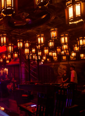 "This image shows Sing Sing Theater, a stylish nightclub in Bangkok with glamorous Chinese opera-house decor, live performances, and DJ sets, offering a unique atmosphere for dancing and fun."