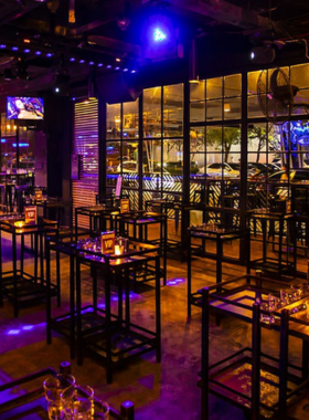 "This image shows Sway, a modern cocktail bar in Sukhumvit, Bangkok, offering a fun yet relaxed atmosphere with trendy drinks, making it the perfect spot for enjoying cocktails with friends or unwinding."