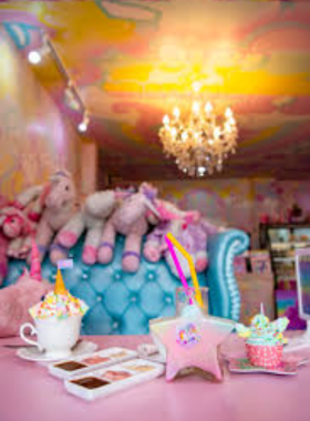 This image shows the colorful Unicorn Cafe in Bangkok, decorated with pastel walls, unicorn-themed furniture, and whimsical decor. It captures the playful and magical vibe of this quirky destination.