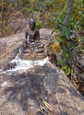 This image shows hikers walking the Buddha's Footprint Trail, passing through serene forests, exploring the peaceful environment, and reaching the sacred Buddha's Footprints in the beautiful hills of Chiang Mai.