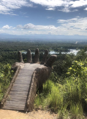 This image shows the stunning Huay Tueng Tao Waterfall along a peaceful hiking trail, surrounded by lush greenery, offering a refreshing stop for nature lovers and adventurers seeking tranquility in Chiang Mai’s wilderness.