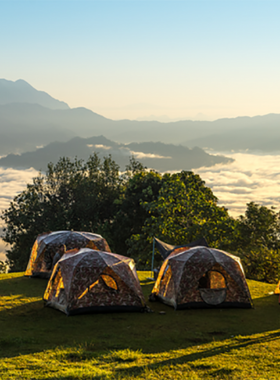 This image shows campers enjoying the cool weather of Huai Nam Dang National Park, with misty mornings, breathtaking sunset views, and a serene environment perfect for nature exploration and outdoor adventures.