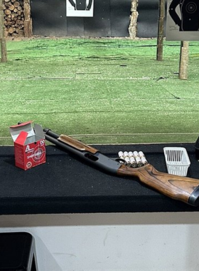 This image shows a person taking aim at the Chiang Mai shooting range, with a variety of firearms available to try in a safe, controlled environment, offering an action-packed adventure for thrill-seekers.