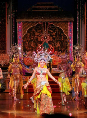 This image shows the mesmerizing performance at Alcazar Cabaret Show in Pattaya, where skilled performers dressed in exquisite costumes entertain the audience with a grand musical and dance extravaganza. The bright stage lights, extravagant costumes, and vibrant performances highlight the grandeur of the show.