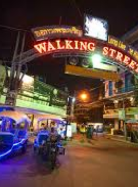 This image shows the vibrant nightlife of Pattaya’s Walking Street, where neon lights illuminate the bustling street. Bars, clubs, and restaurants line the street, offering entertainment and food. The lively atmosphere attracts tourists and locals alike, creating an energetic and unforgettable nightlife experience.