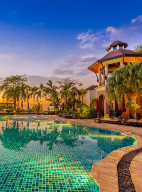 This image shows the luxurious InterContinental Pattaya Resort, featuring its private beach, stunning ocean views, and a variety of restaurants. Guests can enjoy spa treatments, relax by the pool, or stay active at the fitness center. The spacious rooms and high-end amenities offer a perfect getaway for those seeking luxury and comfort.