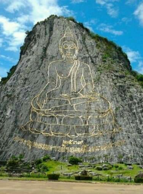 4. Trekking in Khao Chi Chan This image shows that Khao Chi Chan offers a scenic trekking experience, with visitors hiking through lush greenery, surrounded by breathtaking views and a towering Buddha carving on the mountainside.