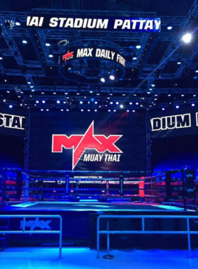 12. Muay Thai at Pattaya Boxing Stadium This image shows that Pattaya Boxing Stadium is the venue for exciting Muay Thai matches, where skilled fighters engage in intense combat while an enthusiastic crowd cheers them on, showcasing the cultural significance of this traditional martial art.