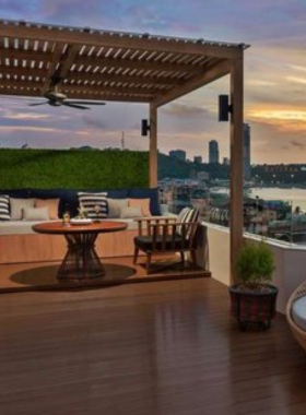 This image shows Hermes Rooftop Bar in Pattaya with stunning panoramic city views, cozy seating, and an elegant ambiance, making it the perfect spot for enjoying sunsets and evening cocktails.