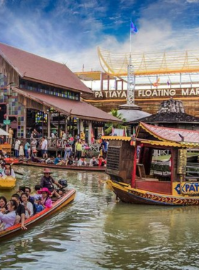 This image shows the vibrant Pattaya Floating Market, where colorful boats line the waterways, selling local food, handmade goods, and Thai souvenirs. The market offers a unique cultural experience, allowing visitors to shop while exploring the traditional Thai way of life on the water.