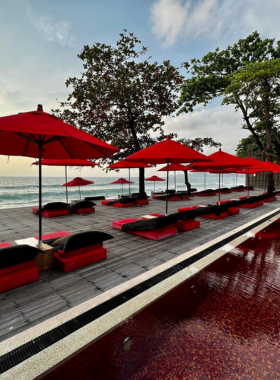 This image shows the distinctive red swimming pool at The Library, a design-focused boutique hotel on Chaweng Beach. The minimalist architecture and artistic ambiance create a peaceful and creative environment for guests.