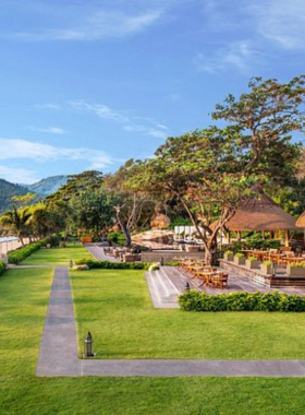 This image shows a private villa with a pool at Vana Belle Resort, offering a secluded escape with beautiful views of the Gulf of Thailand. The resort emphasizes wellness with its spa, yoga classes, and top-tier dining options.