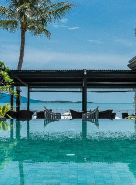 This image shows the serene pool area at Scent Hotel, an eco-conscious boutique hotel located near Lamai Beach. The tranquil atmosphere, fitness center, and wellness programs make it a perfect destination for relaxation and eco-friendly luxury.