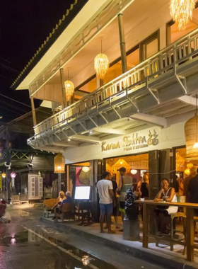 This image shows Karma Sutra Bar & Kitchen in Bophut, Koh Samui, a cozy restobar with rustic decor, soft lighting, and a warm atmosphere perfect for a relaxing evening.