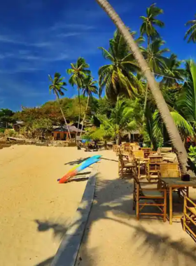 This image shows a stunning sunset over Thongson Beach in Koh Samui, a quiet and secluded beach with crystal-clear waters. The peaceful beach offers an ideal setting for swimming, sunbathing, and enjoying the serene atmosphere away from the crowds.