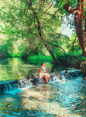 This image shows the natural hot springs of Pai, where visitors relax in warm, mineral-rich water surrounded by lush greenery. The springs, located in a tranquil setting, offer a rejuvenating experience for visitors looking to unwind. The hot springs are perfect for those seeking relaxation and healing in Pai's peaceful natural environment.