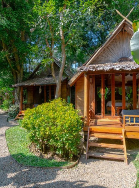 This image shows Pai Village Boutique Resort, a charming boutique resort located near the center of Pai. The resort offers cozy rooms with modern amenities, a lovely garden area for relaxation, and exceptional service. Guests can enjoy a peaceful atmosphere while being close to Pai's markets and local attractions.