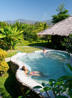 This image shows Pai Hotsprings Spa Resort, a tranquil getaway with access to natural hot springs. The resort offers relaxing accommodations with scenic views, outdoor activities, and a delicious on-site restaurant. It's the perfect place for guests looking to unwind and rejuvenate in the soothing waters of Pai’s famous hot springs.