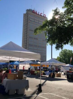 This image shows the lively Waco Downtown Farmers Market, with local vendors selling fresh produce, handcrafted goods, and delicious food. The vibrant atmosphere is enhanced by live music and the bustling crowd, making it a perfect place to enjoy local culture.