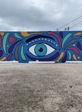 This image shows one of the colorful murals in Waco, Texas, highlighting local street art. The vibrant artwork captures the city’s creativity and serves as a perfect spot for visitors to take Instagram-worthy photos of the city’s artistic spirit.