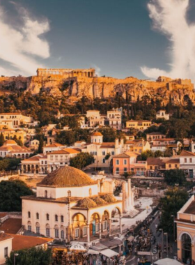 This image shows the lively Monastiraki neighbourhood in Athens, a blend of ancient ruins, lively streets, and vibrant markets. The square offers beautiful views of the Acropolis and is the perfect place to explore its flea market, cafes, shops, and restaurants, capturing the essence of Athens’ culture.