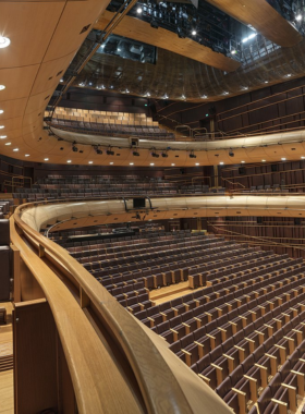 This image shows the Onassis Stegi, a contemporary cultural venue in Athens, where art, theater, and music converge. The venue hosts various performances, including theater, dance, and music, while its rooftop restaurant offers breathtaking views of the Acropolis, making it a perfect spot for art lovers.