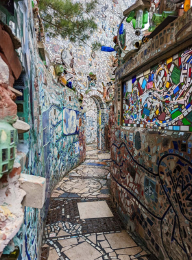 This image shows the beautiful and colorful mosaics at Philadelphia’s Magic Gardens. Created by artist Isaiah Zagar, this unique installation features intricate designs, making it a captivating spot for visitors to explore and be inspired by creativity.