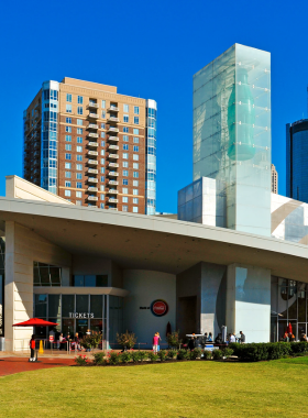 This image shows the World of Coca-Cola, with its bright red and white branding, interactive exhibits, and visitors exploring the world-famous beverage’s history. The scene captures the fun and informative experience offered to guests.