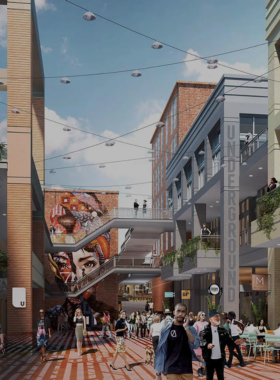 This image shows Underground Atlanta, featuring colorful market stalls and lively crowds exploring shops and eateries. The space reflects a mix of historical charm and modern entertainment.