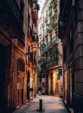 This image shows the narrow, cobblestone streets of the Barri Gòtic, or Gothic Quarter, in Barcelona. It captures the medieval architecture, charming plazas, and hidden corners that transport visitors back in time to explore the city's rich history.