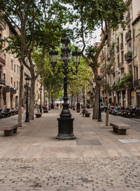 This image shows the lively streets of the El Born neighborhood in Barcelona, filled with trendy bars, cafes, and boutique shops. At night, the area transforms into a vibrant hub, offering a perfect blend of culture and entertainment.