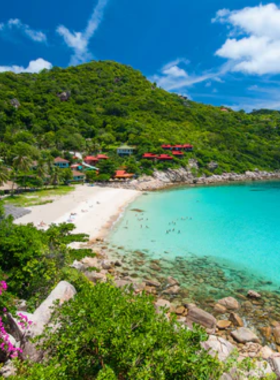 This image shows the tranquil atmosphere of Ao Leuk Beach, a quiet spot on Koh Tao known for its soft white sand and crystal-clear waters. The peaceful environment makes it an ideal place for relaxing, swimming, and snorkeling in a calm, beautiful setting.