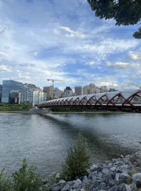 This image shows a cyclist riding along the Bow River Pathway, a long and scenic cycling trail that runs through Calgary. The pathway offers beautiful views of the river, parks, and the downtown skyline, providing the perfect route for outdoor enthusiasts to enjoy a peaceful bike ride or jog while staying active and immersed in the natural beauty of the area. It’s a top spot for both locals and tourists seeking a bit of adventure within the city.