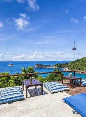 This image shows Ao Leuk Bay Resort, featuring cozy beachfront villas that provide direct access to the crystal-clear waters of Ao Leuk Bay. The resort is perfect for diving enthusiasts with vibrant coral reefs just nearby.