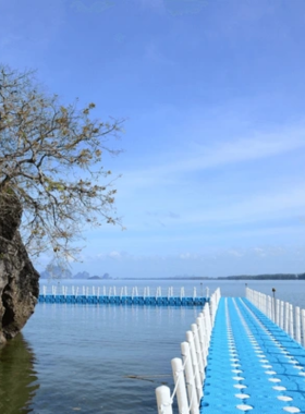 This image shows Chao Mai Beach, a hidden coastal gem along Trang’s coastline. The scene captures the calming waves and serene environment, with a few visitors lounging and soaking in the tranquil seaside vibes.