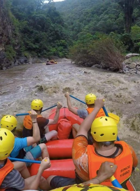 This image shows whitewater rafting on Pai River, with a group of adventurers navigating through thrilling rapids. The surrounding lush greenery and splashing waters highlight the excitement and natural beauty of the experience.