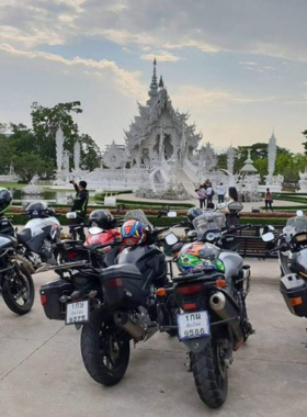 This image shows riders on the Golden Triangle Motorcycle Loop, traversing winding mountain roads with scenic views. The adventure captures the thrill of riding amidst lush greenery and cultural landmarks.