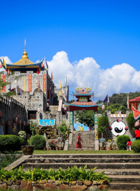 This image shows Santichon Village in Pai, Thailand, featuring traditional Chinese-style architecture, scenic views, and cultural activities like tea tasting and handicrafts.